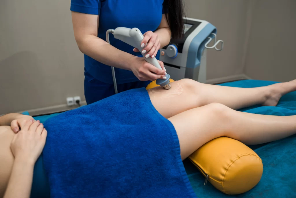 Shock Wave Therapy (ESWT) treatment for leg muscle recovery — promotes healing of soft tissue injuries, improves circulation, and reduces muscle fatigue caused by overexertion.